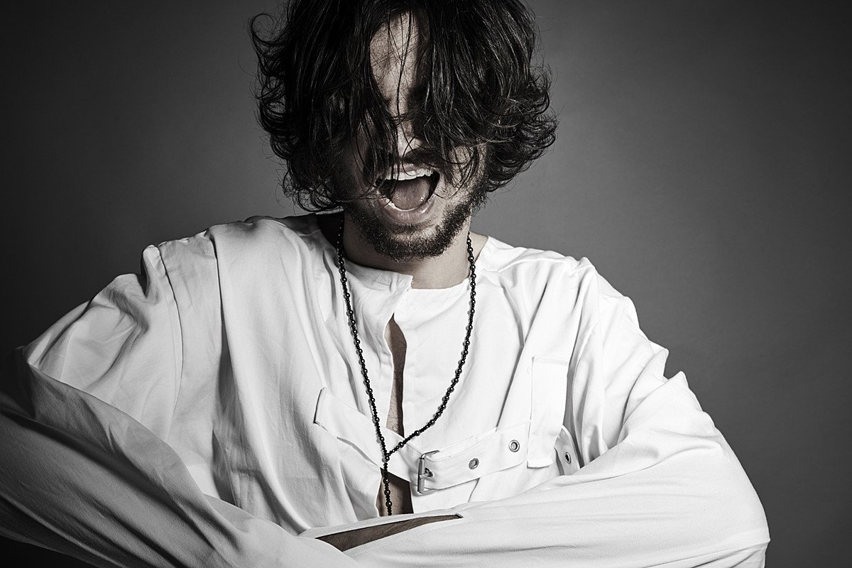 Сумасшедший в смирительной рубашке