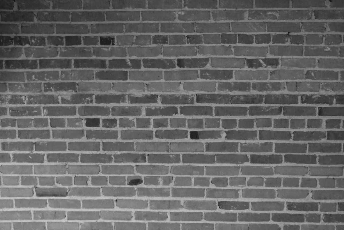 Серый кирпич стена