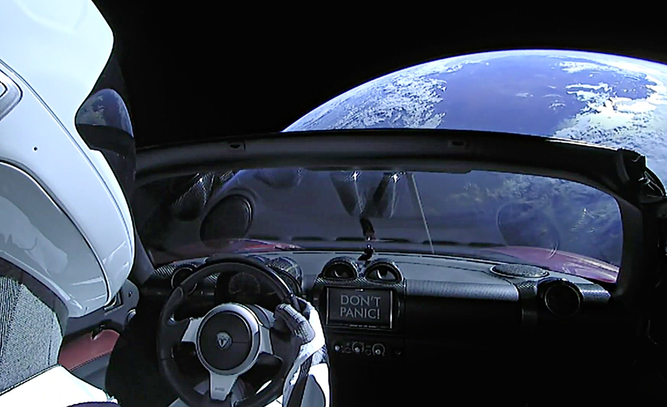 Где машина маска. Илон Маск Тесла в космосе. Falcon Heavy Tesla Roadster.