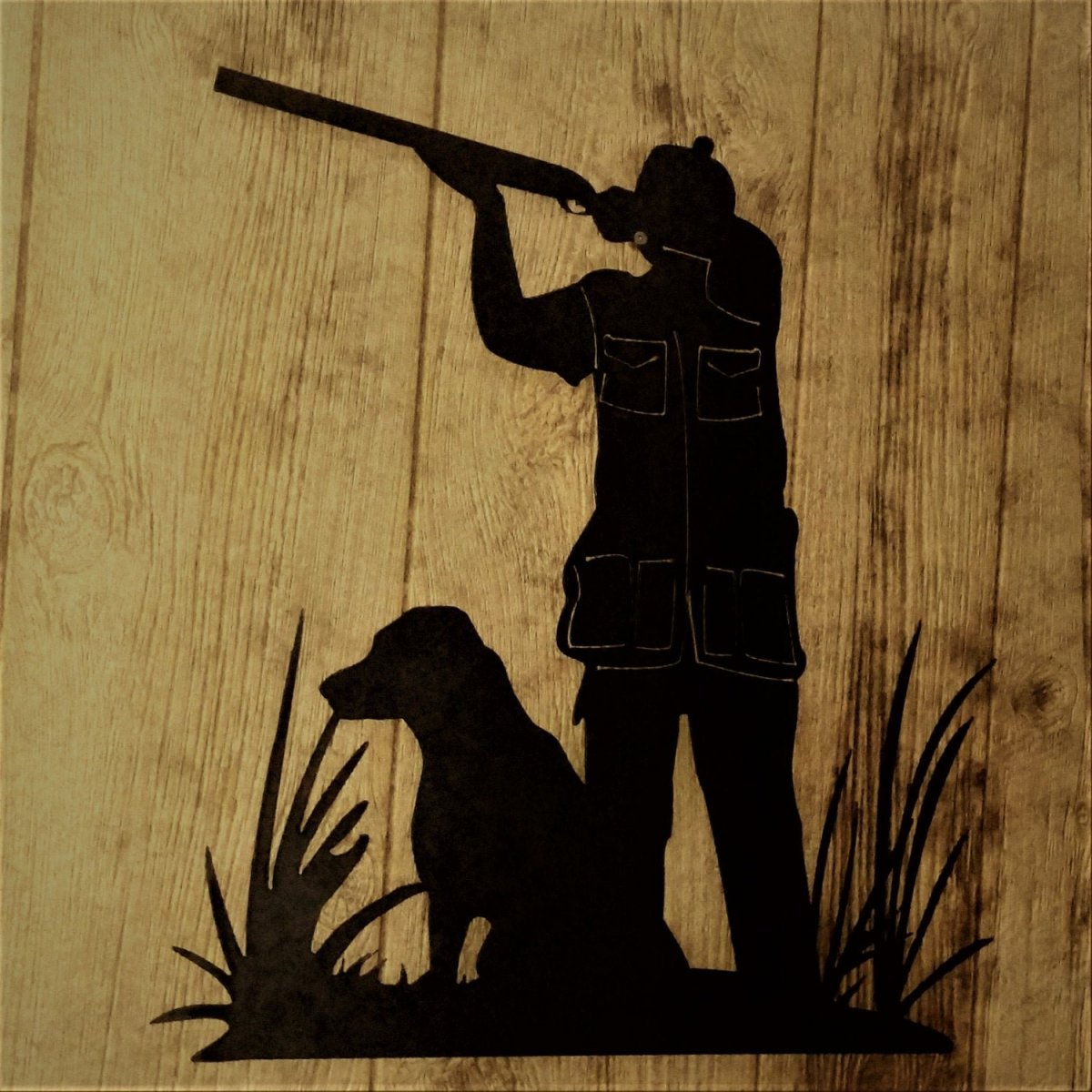 Силуэт охотника с ружьем и собакой