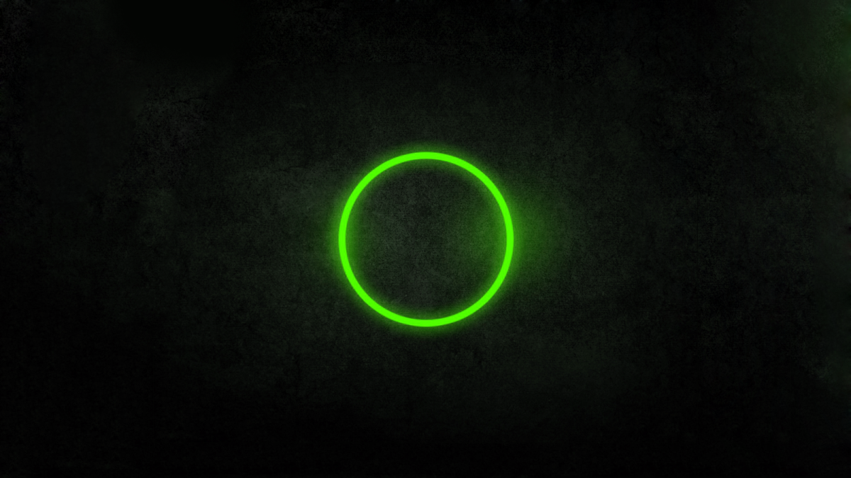 Зеленый круг на черном фоне