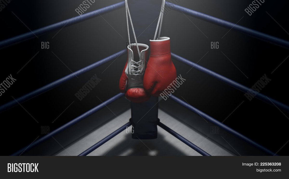 Боксерские перчатки в углу ринга